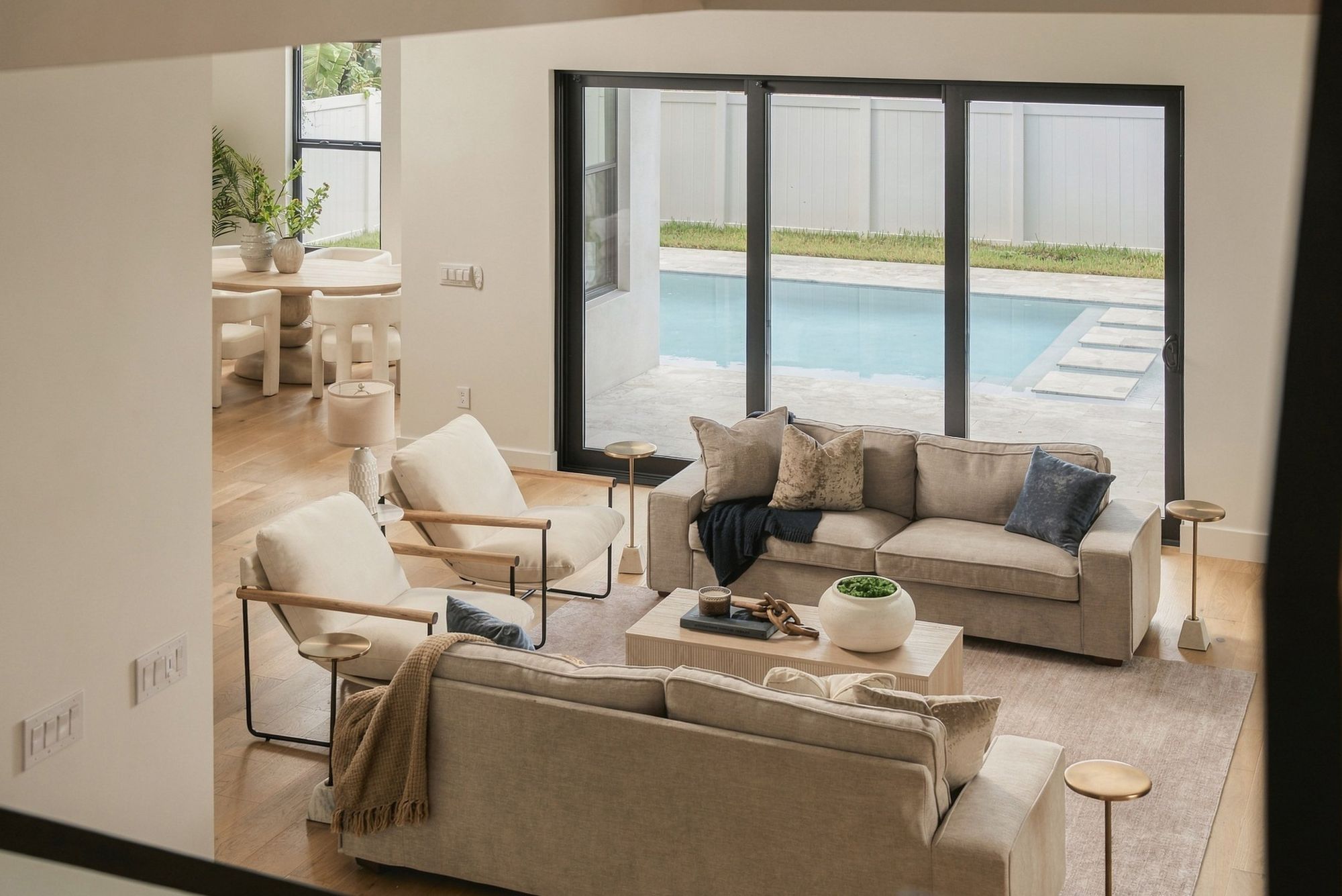 Living room with sliding doors to the pool